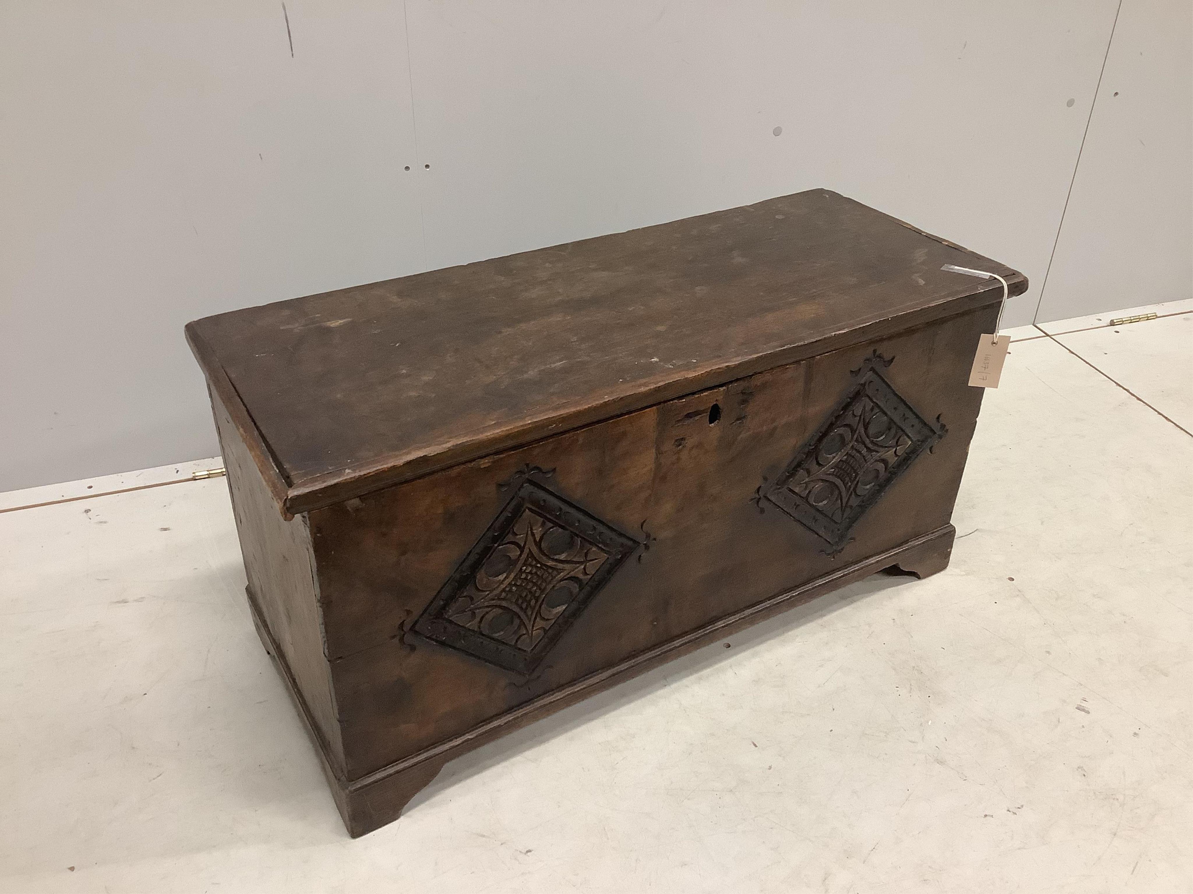 A small 17th century style carved fruitwood six plank coffer, width 91cm, depth 38cm, height 46cm. Condition - fair